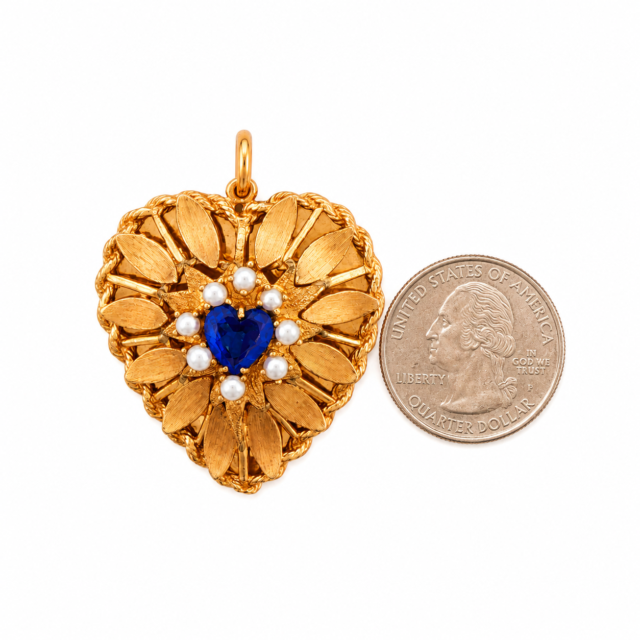 1950s gold heart pendant shown beside a U.S. quarter for scale, front view