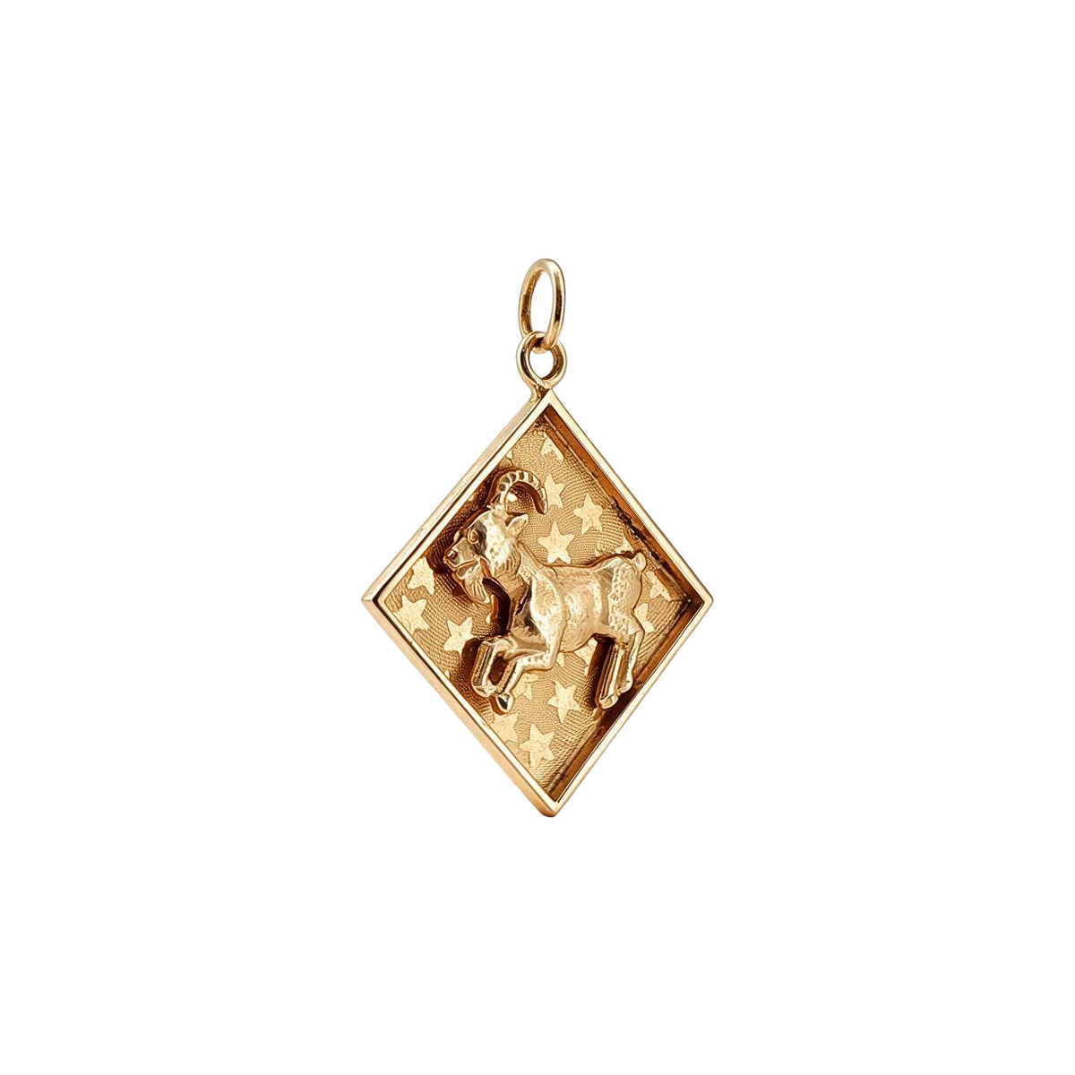 Angled view of 14k gold vintage Aries ram charm showing the raised ram and star background