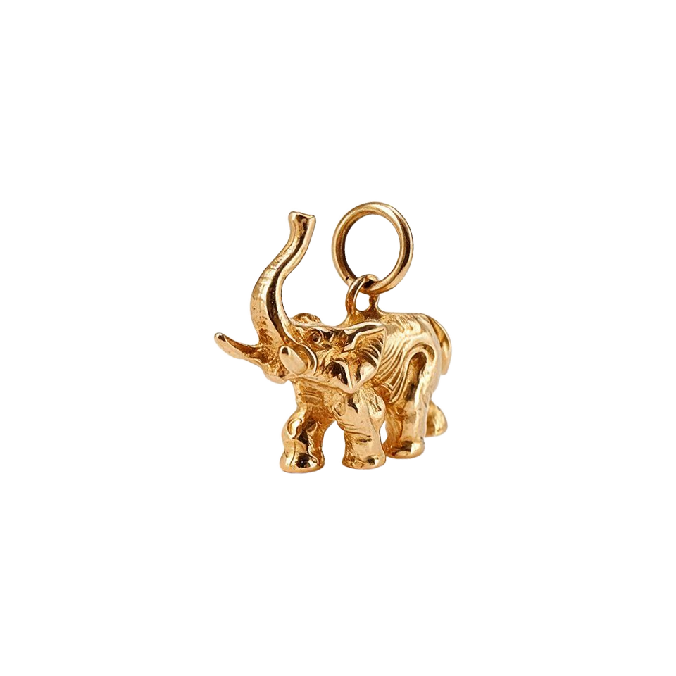 Angled view of 14k gold vintage elephant charm showing sculpted ears and trunk