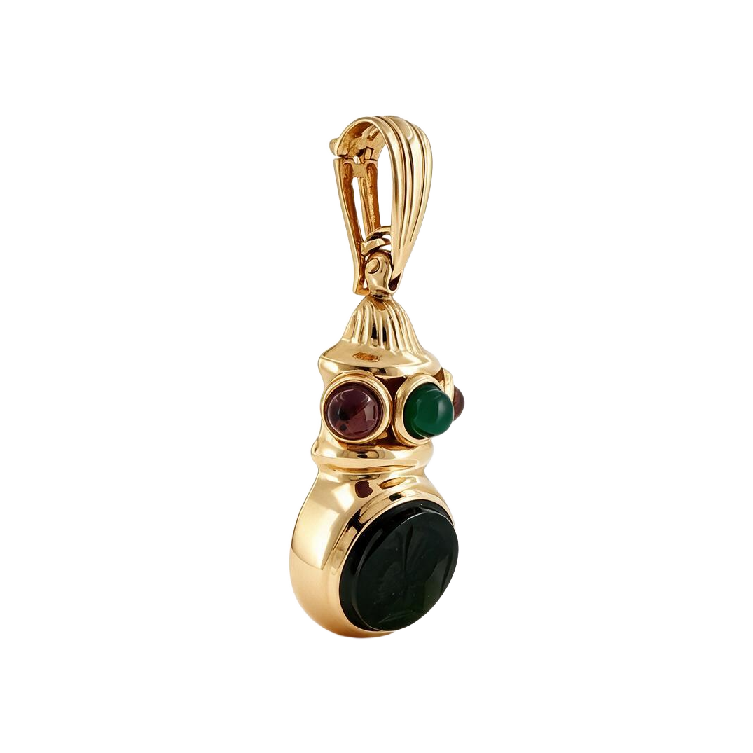 Angled view of 18k gold intaglio pendant showing bezel set cabochons and opening enhancer bail