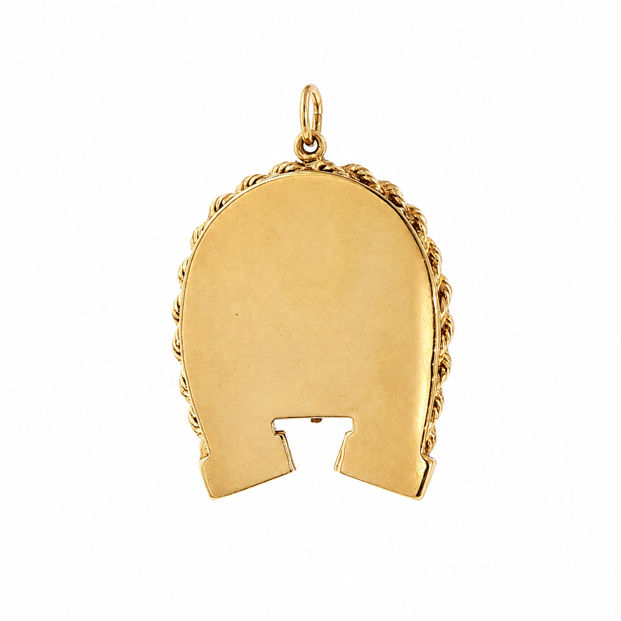 Back of 1960s 14 karat gold horseshoe locket showing polished reverse and hinge cutout