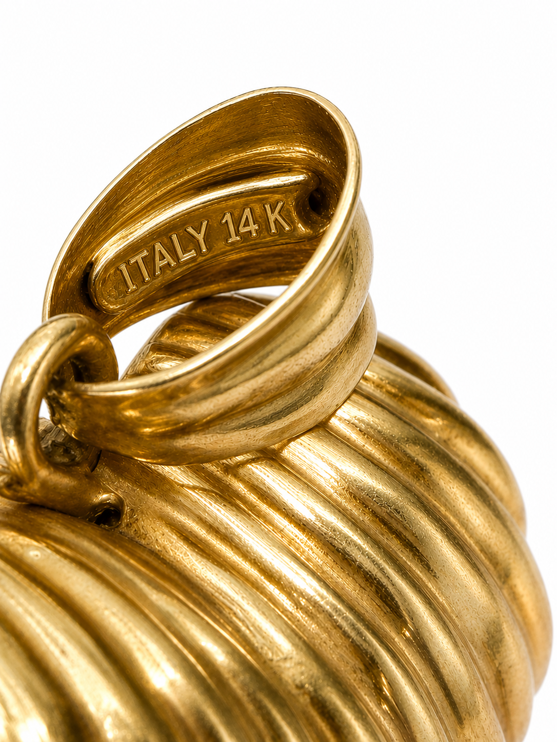 Vintage Italian 14 Karat yellow gold puffy ribbed heart pendant with Italy 14K hallmark, close-up of bail