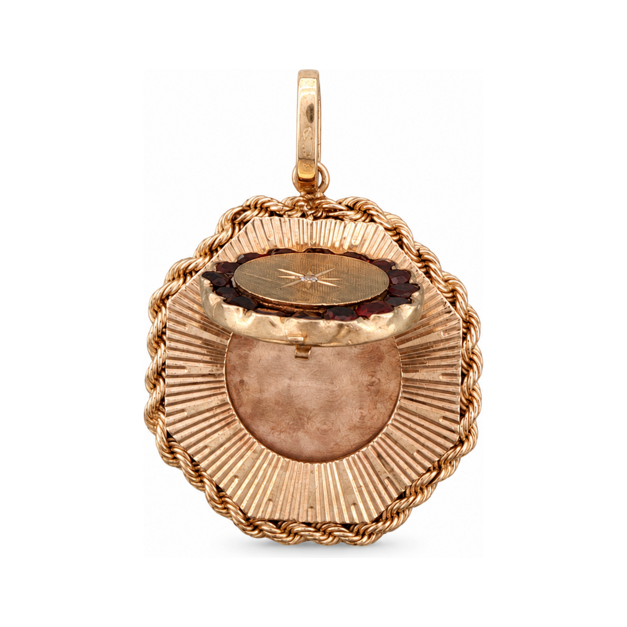 14 karat yellow gold mid-century locket shown open, revealing the interior photo compartment.