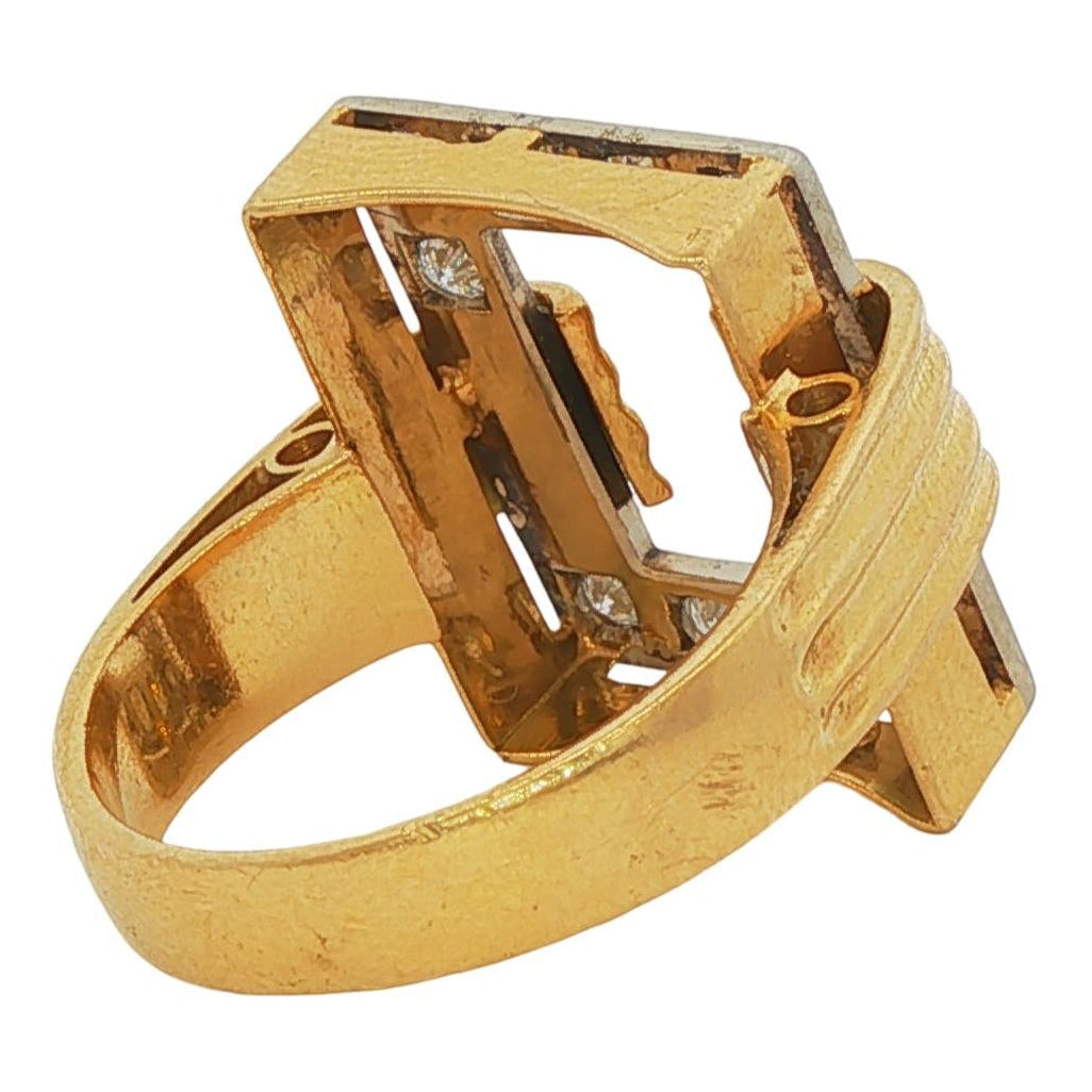 Top view of a 1980s 18 karat yellow gold Modernist cocktail ring with a rectangular face, ribbed gold detailing, and 1 carat of pavé diamonds
