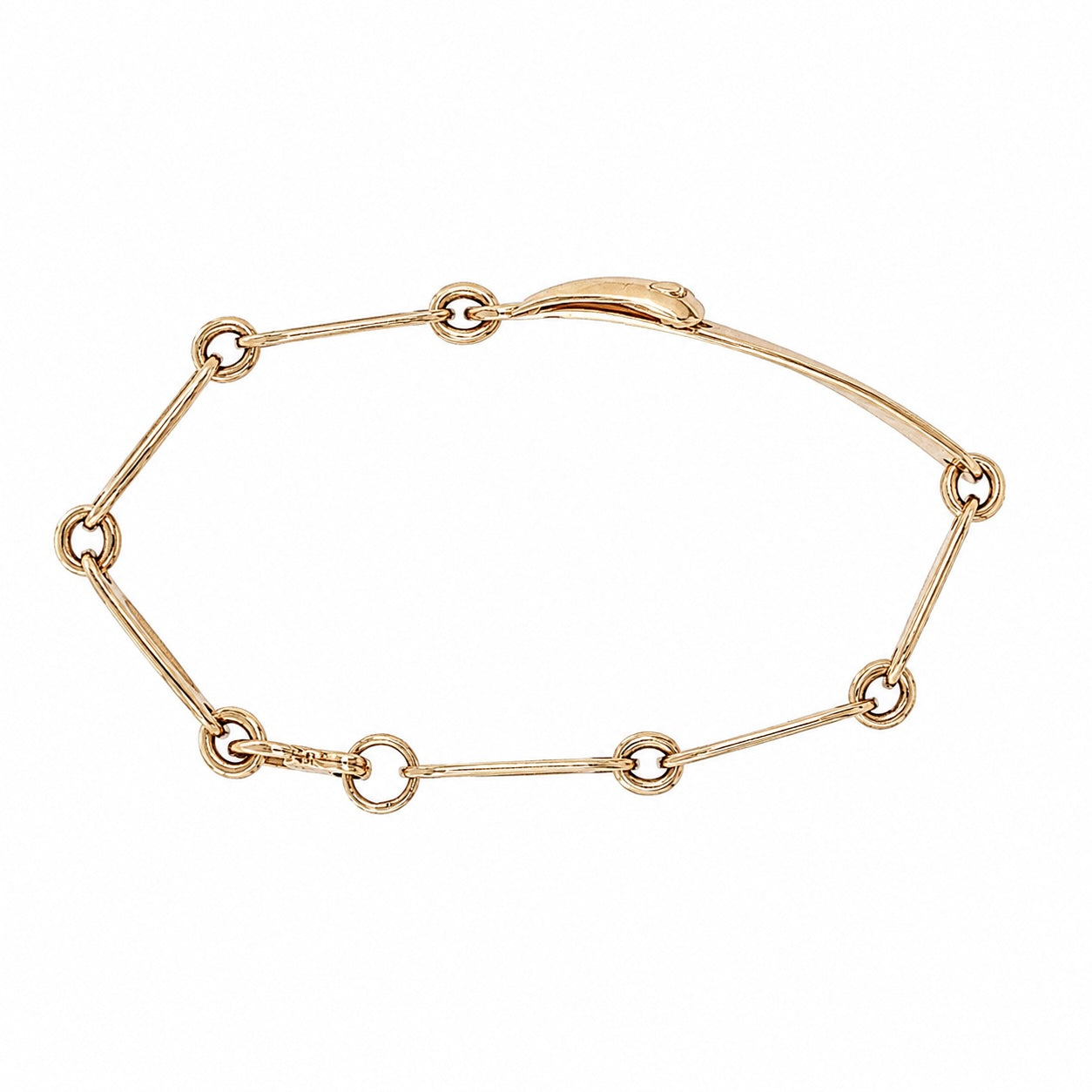 Back view of vintage gold belt buckle bracelet showing slender bar links and round rings