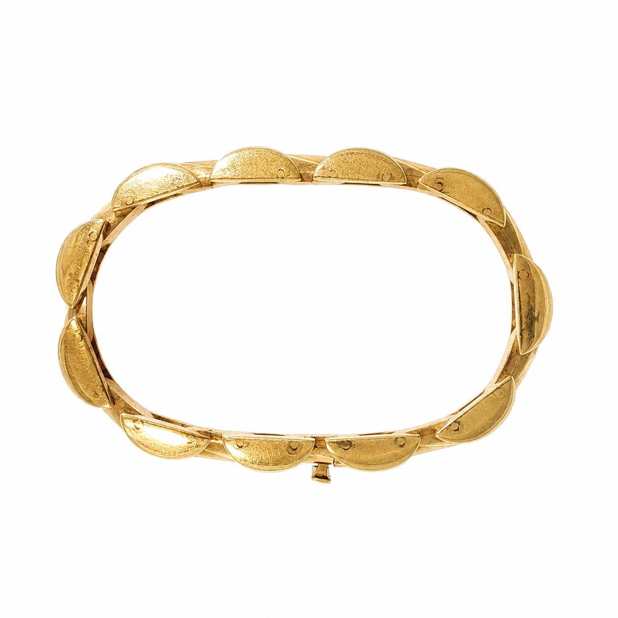Underside of vintage 14K yellow gold tank bracelet showing articulated link construction