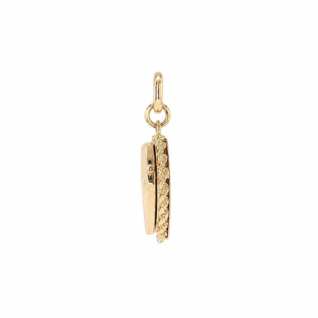 Side profile of 1960s gold heart locket showing rope-twist frame and slim hinged case
