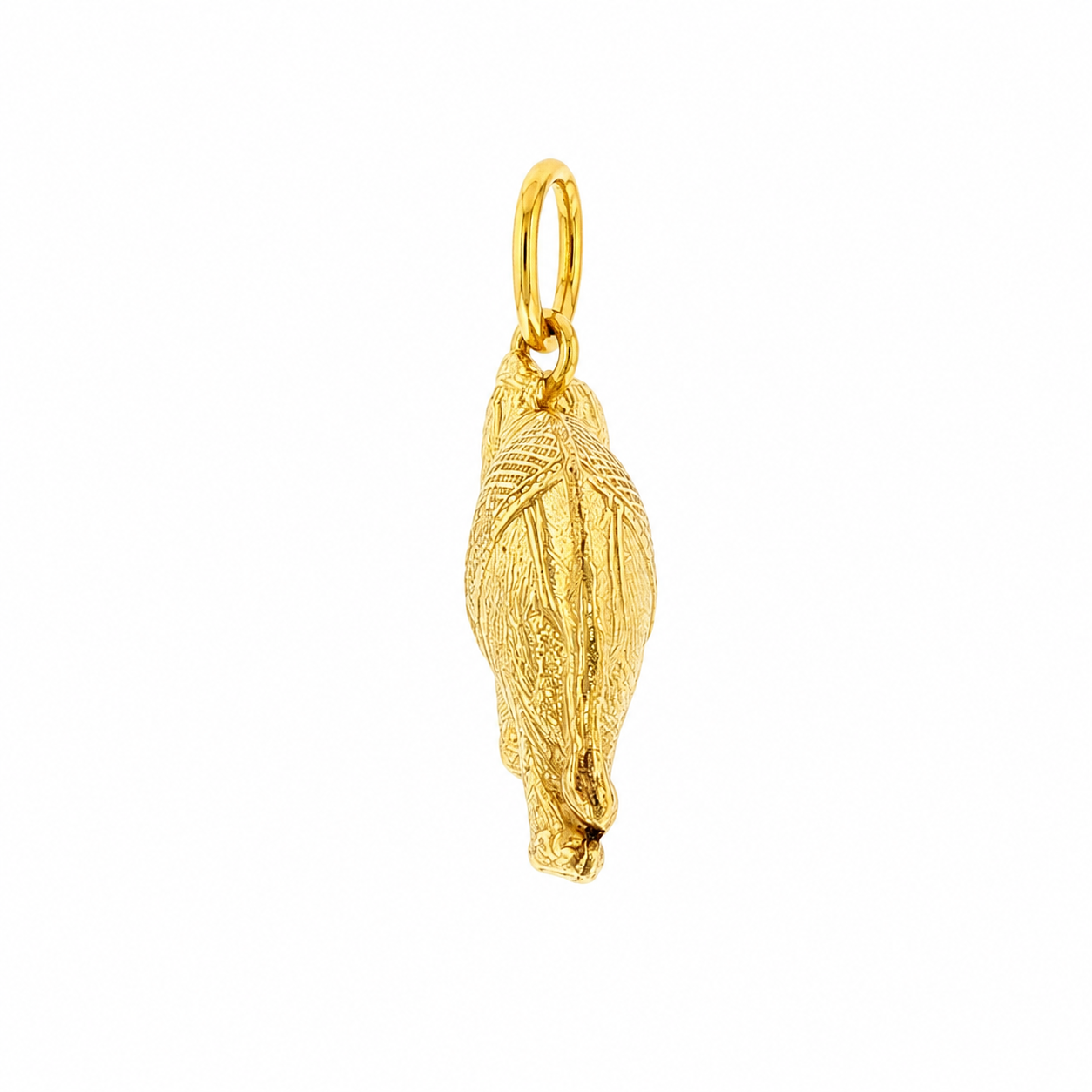 1970s 18k yellow gold elephant charm with raised trunk and engraved saddle detail