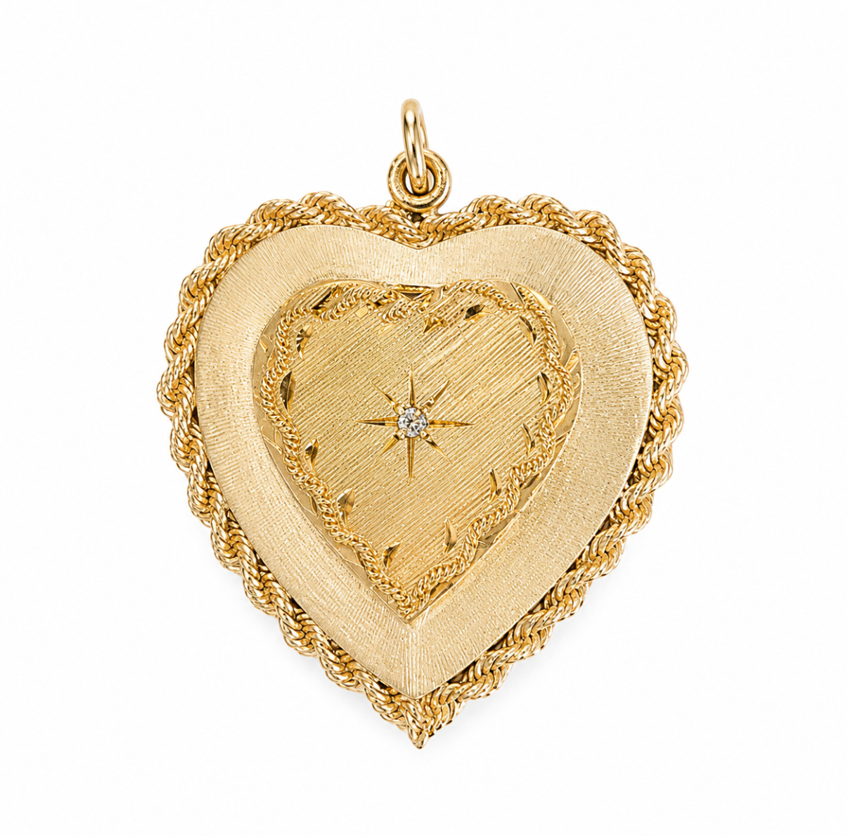 14 karat yellow gold puffy heart locket with florentine finish, rope-twist trim, and starburst diamond center.