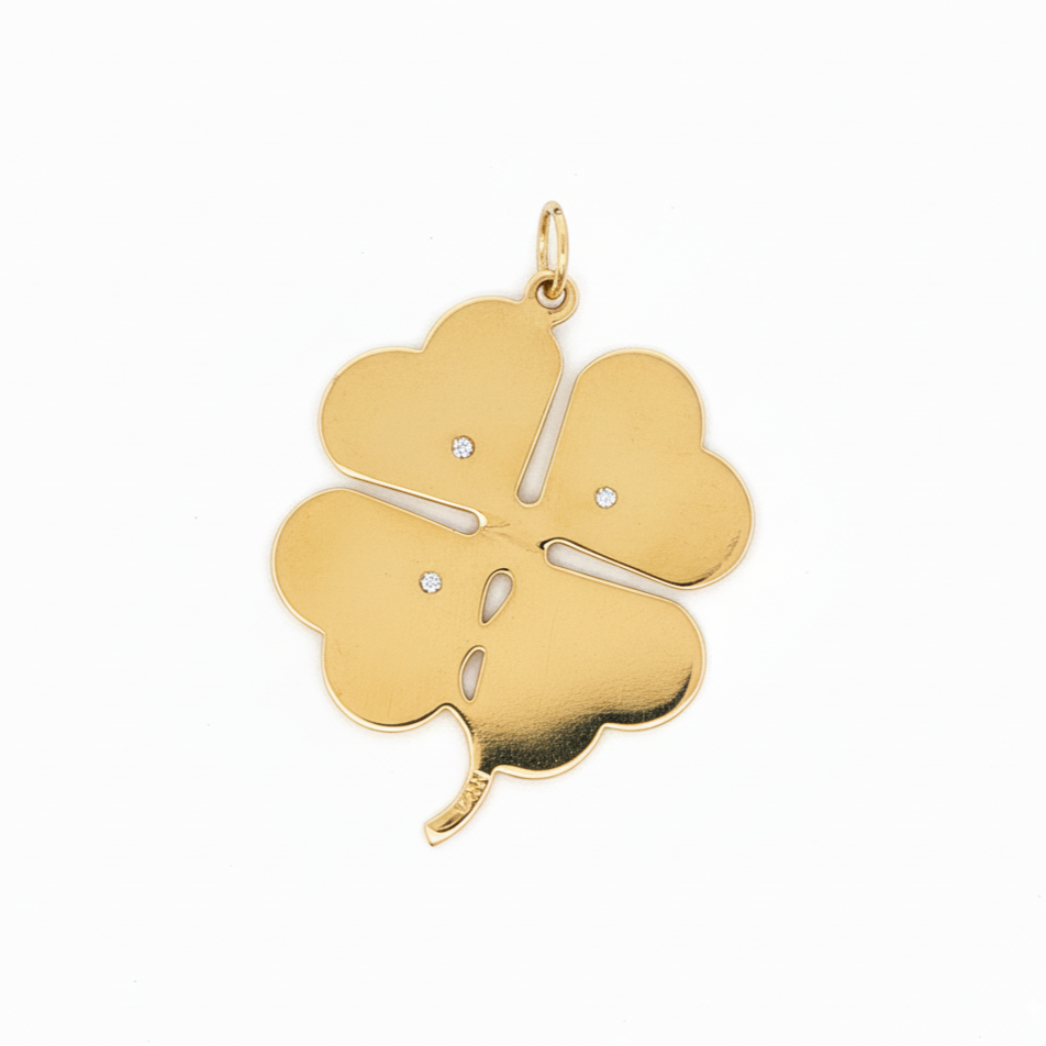 Vintage 1950s 14k gold clover charm with pearls and rubies, engine-turned back view