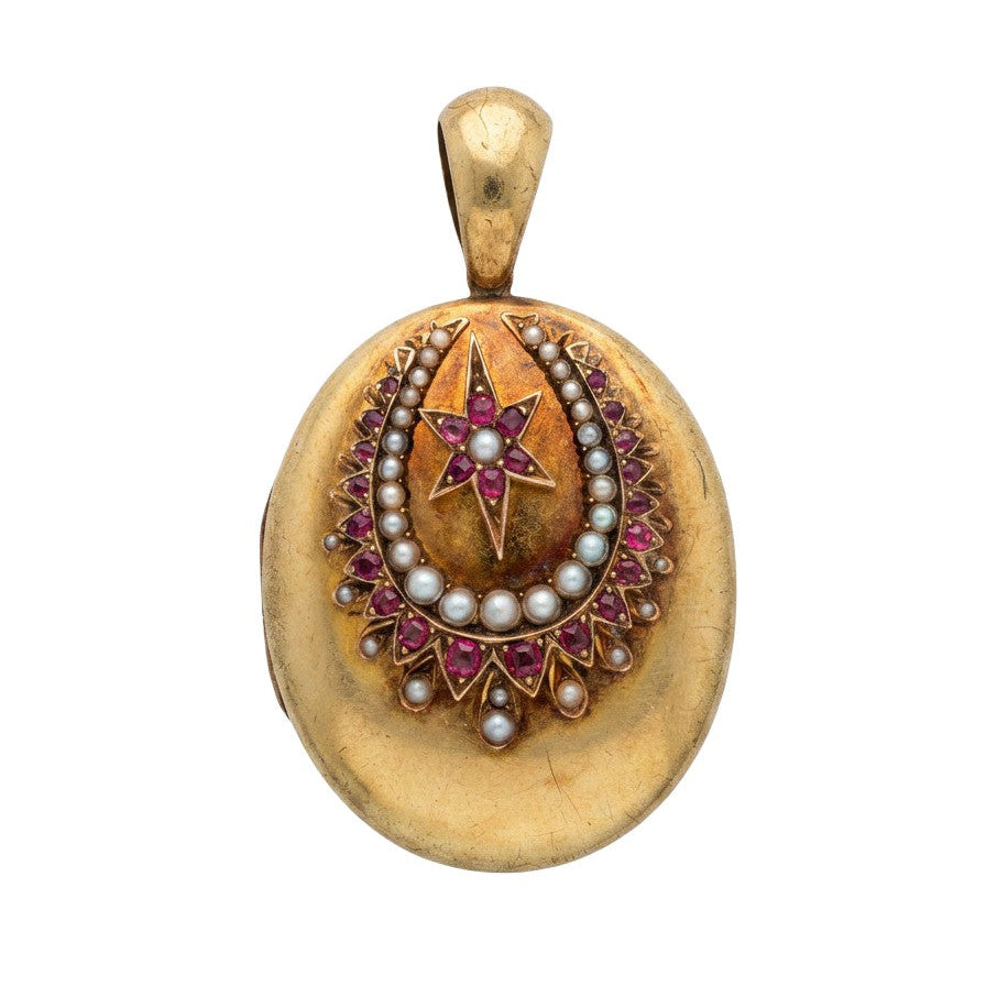 Victorian 14 Karat yellow gold oval horseshoe locket with ruby and seed pearl starburst motif, front view