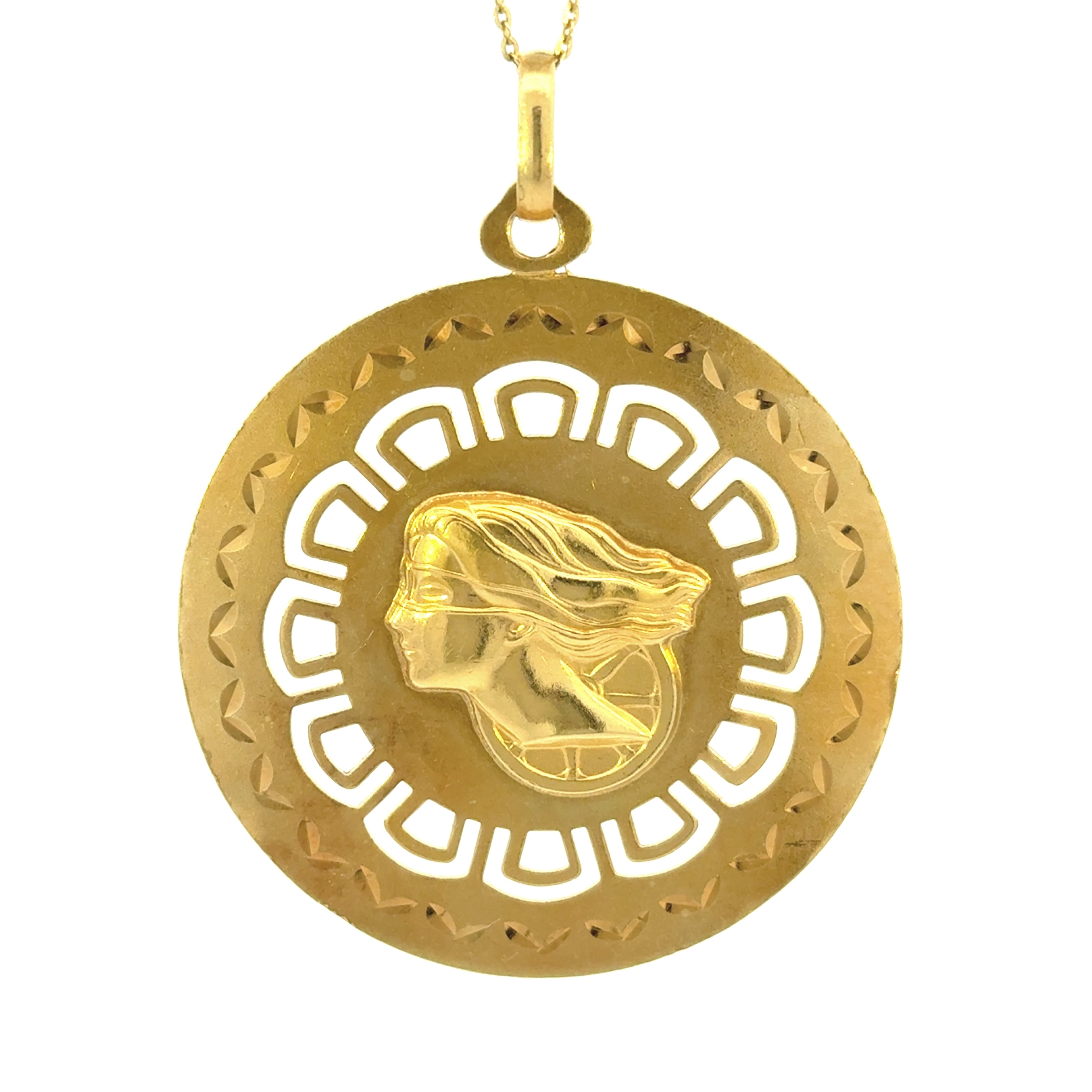 An 18K yellow gold vintage double-sided charm featuring a cut-out design with a regal depiction of a woman, likely a representation of Nefertiti, on the front.