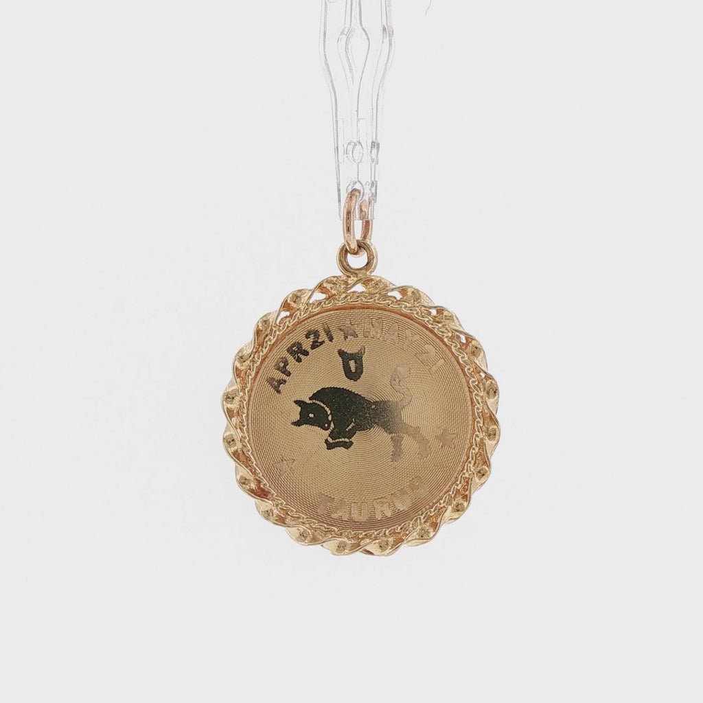 Video of a 14k yellow gold vintage Taurus zodiac rope border charm