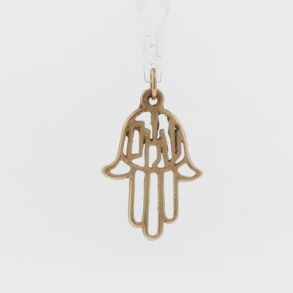 Video of a 14k yellow gold vintage openwork Shalom hamsa charm