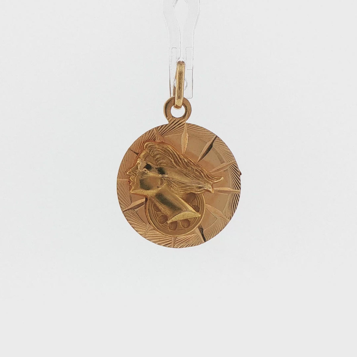 Video of an 18k yellow gold vintage two sided Nefertiti and Lady Fortuna medallion charm