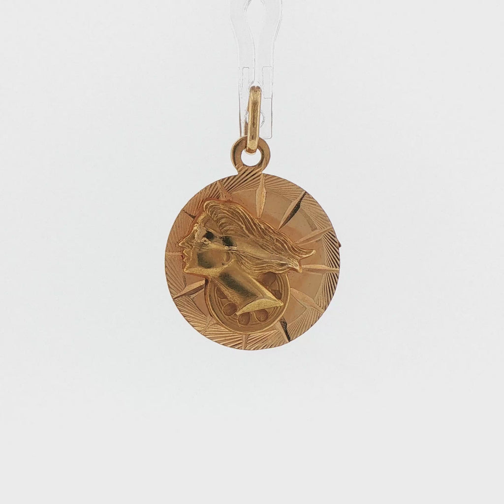 Video of an 18k yellow gold vintage two sided Nefertiti and Lady Fortuna medallion charm