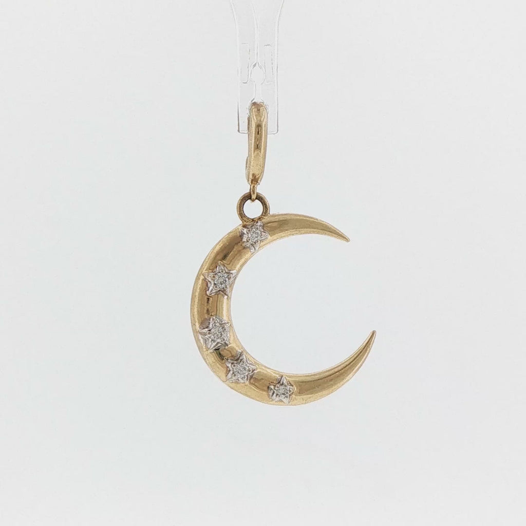 Video of a 14k yellow gold crescent moon charm with diamond stars