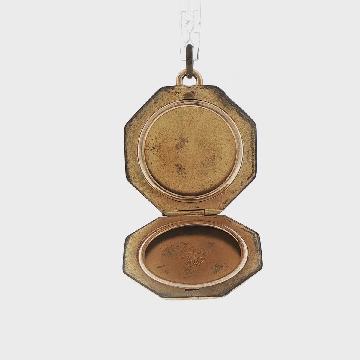 Video of a 14k yellow gold vintage engine turned octagonal locket