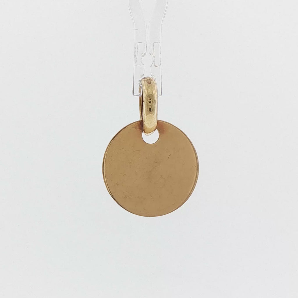 Video of a small 14k yellow gold vintage engravable disc charm