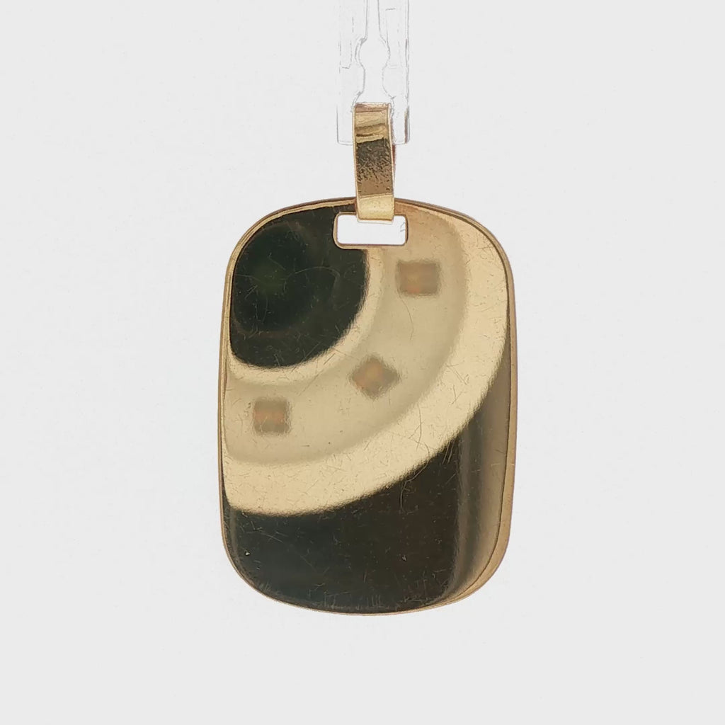 Video of a 14k yellow gold vintage engravable dog tag charm