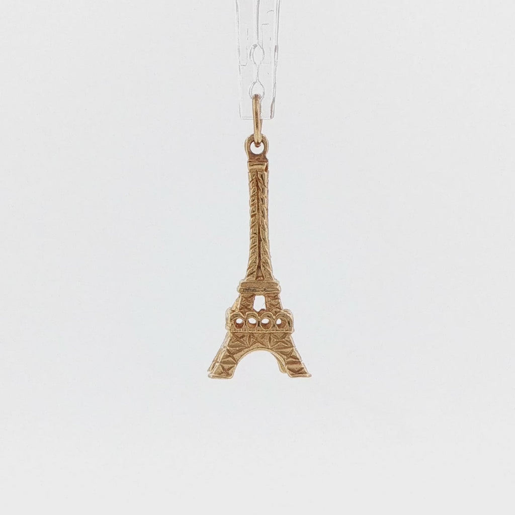 Video of a 14k yellow gold 1960s vintage Eiffel Tower charm