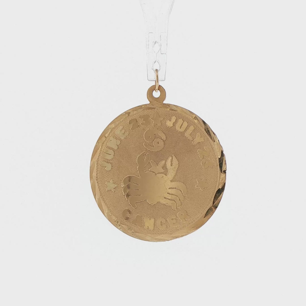 Video of a 14k yellow gold vintage Cancer zodiac disc charm