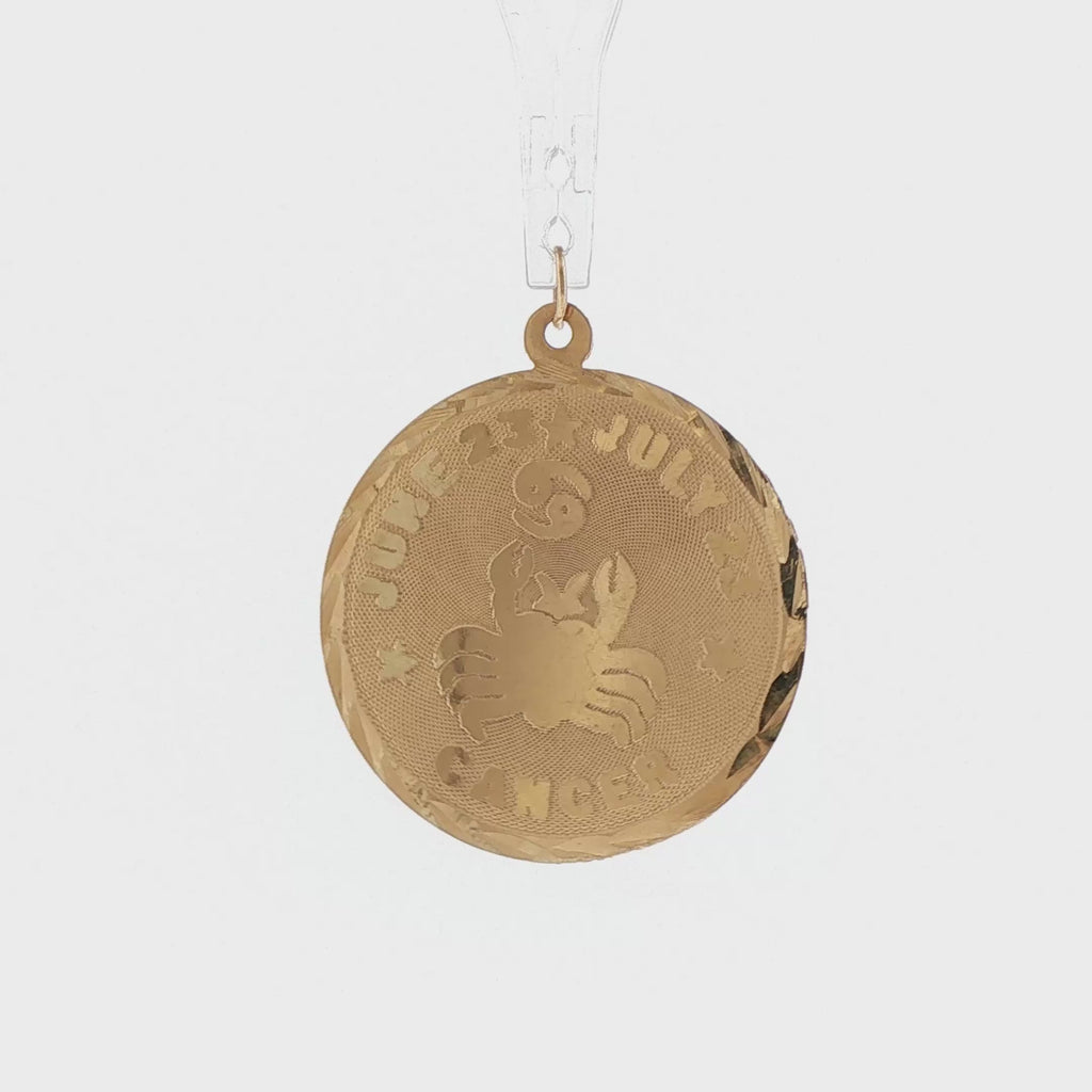 Video of a 14k yellow gold vintage Cancer zodiac disc charm