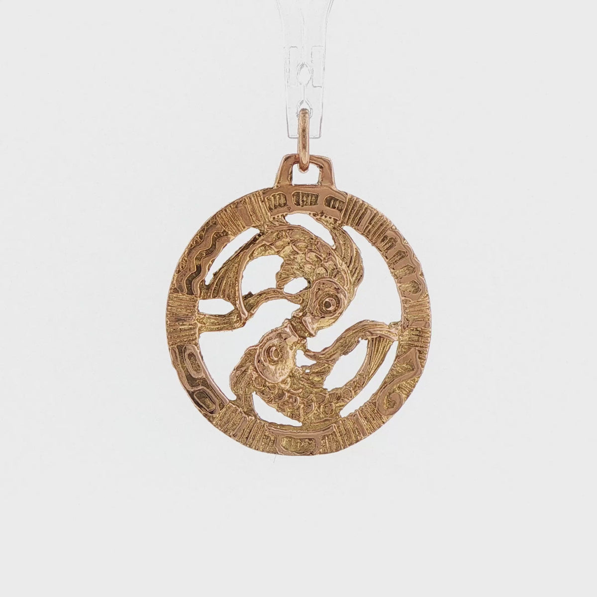 Video of a 14k yellow gold vintage Pisces double fish openwork charm