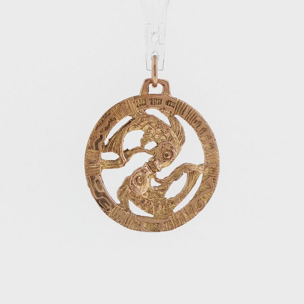Video of a 14k yellow gold vintage Pisces double fish openwork charm