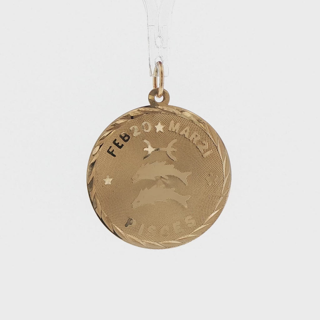 Video of a 14k yellow gold vintage flat Pisces zodiac charm